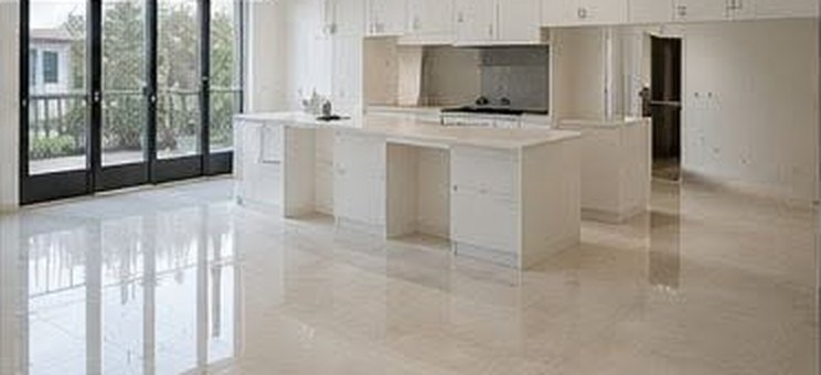 The same kitchen after cleaning, polished floors and dust-free cabinets