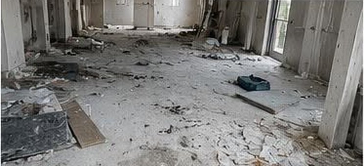 Construction site before cleaning, debris and dust across the floor