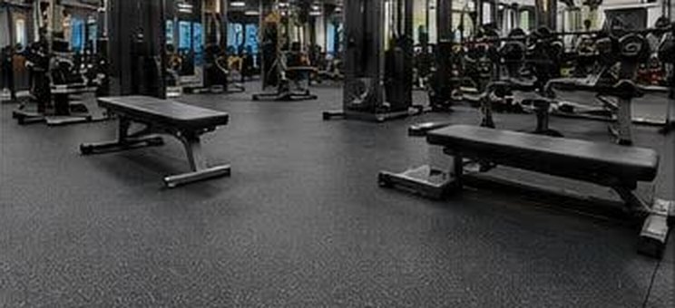The same gym after cleaning, equipment in place and floors spotless